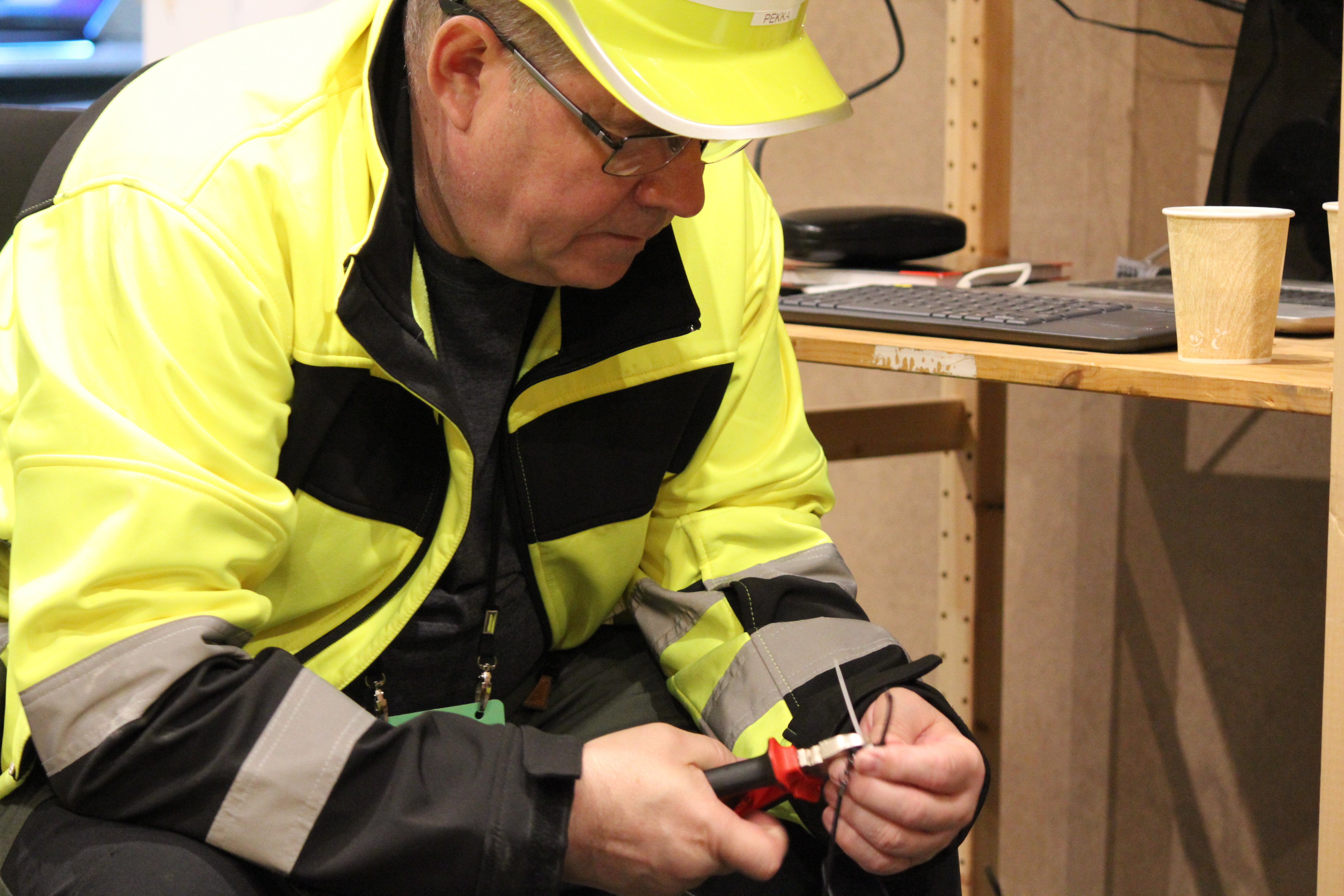 Technician working on a small electronic device